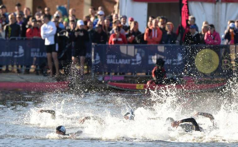 Open water: The competitors swam 2km in Lake Wendouree for the first leg of the Ironman 70.3.