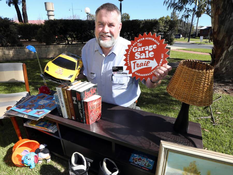 Wodonga councillor John Watson with some items to announce 'The Garage Sale Trail'. Picture: PETER MERKESTEYN