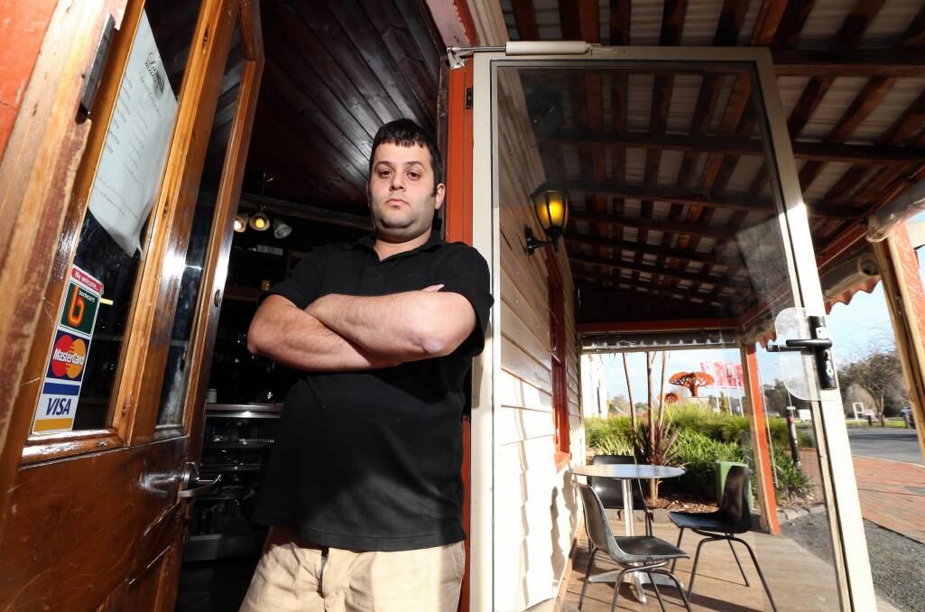 Wassim Saliba outside his Gateway Island cafe, La Maison, after the 24th time it was broken into. Picture: JOHN RUSSELL