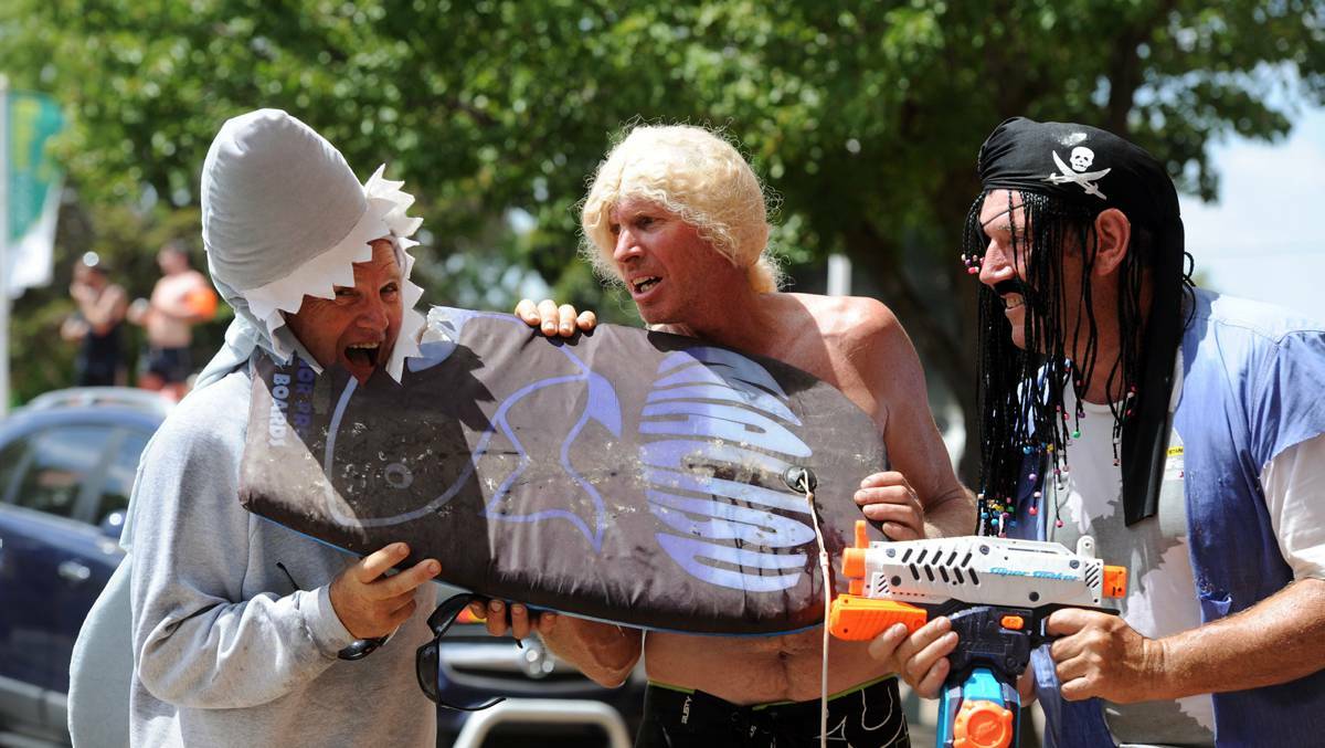 Kelvin Crutch, Richie Middleton and Darcy Penrose make a shark cull statement at Edenhope's Henley on Lake Wallace parade. The Conniwerico Tennis Club always has a political float. Pictures: PAUL CARRACHER – The Wimmeral Mail Times