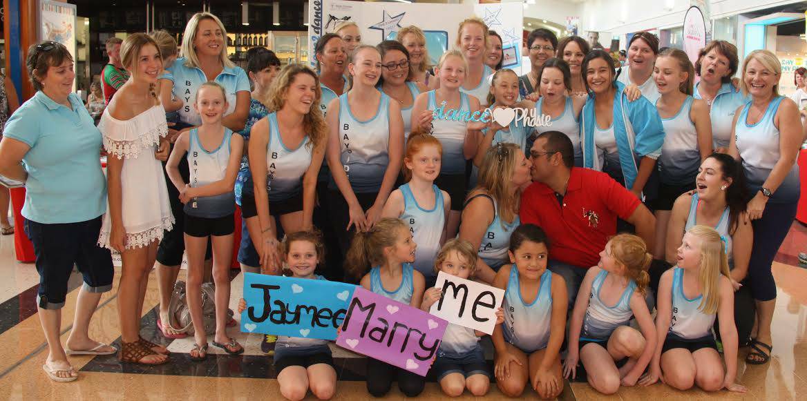 Bayside Physie Club members staged a flash mob dance at Victoria Point Shopping Centre last Saturday in which Diego Suarez proposed to his girlfriend and club member Jaymee Chelman. The kissing couple, pictured, will marry at Manly in June.Photo courtesy of Bayside Physie Club