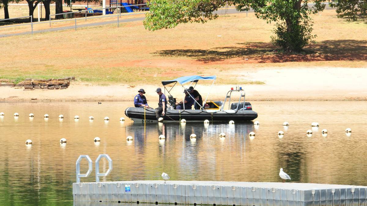 ORANGE: Police search Lake Canobolas on Monday for the body of missing backpacker Arvid Stenzel . His body was later recovered. Photo: LUKE SCHUYLER 0210LSRESCUE7