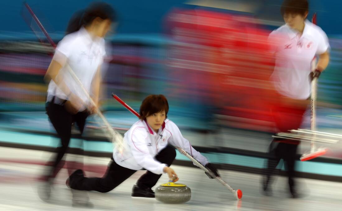  Ayumi Ogasawara of Japan delivers the stone during the Curling Women's Round Robin match between Japan and Great Britain on day seven of the Sochi 2014 Winter Olympics at Ice Cube Curling Center. Photo by Robert Cianflone/Getty Images