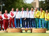 Andrew Knapper, John McGuinness, Stuart Airey, and Jamie Chestney of England, David Peacock, Neil Speirs, Paul Foster, and Alex Marshall of Scotland, Wayne Ruediger, Brett Wilkie, Nathan Rice, and Matt Flapper of Australia celebrate with their medals after the Men's Fours Final. Photo: Getty Images