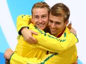 Silver medalists Matthew Mitcham (left) and Grant Nel of Australia celebrate during the medal ceremony for the Men's Synchronised 3m Springboard Final at Royal Commonwealth Pool. Photo: Getty Images