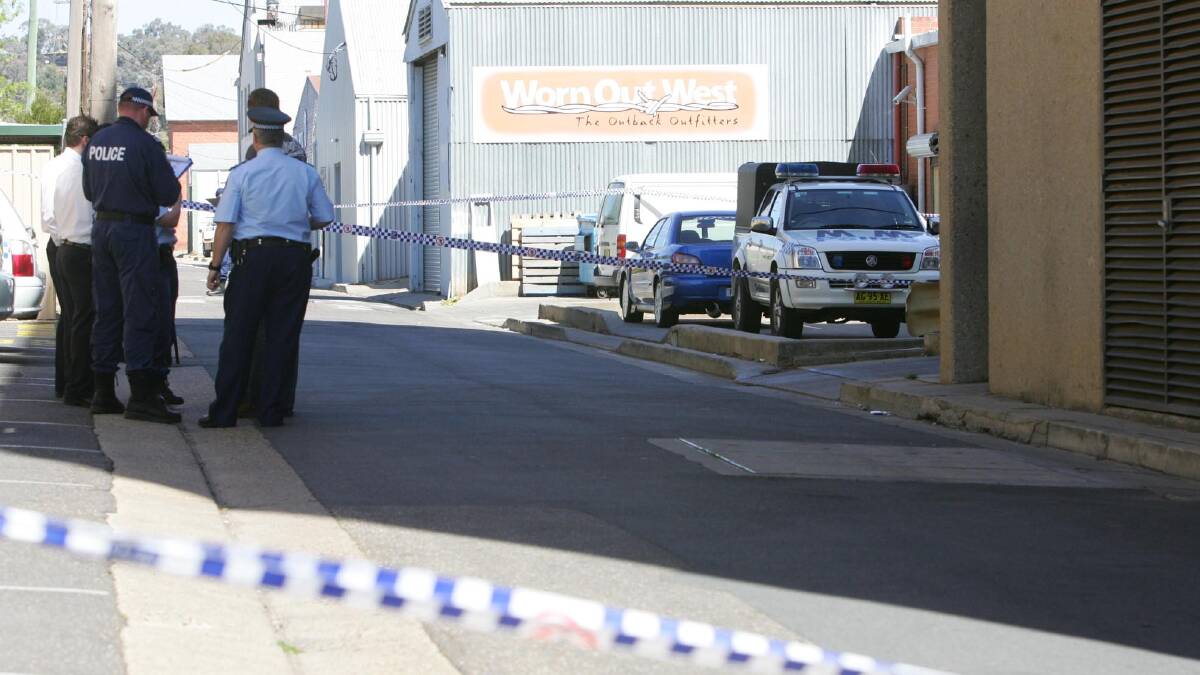Police gather at the crime scene in 2006. Picture: Les Smith