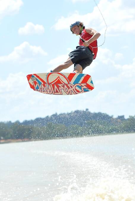 Lewy Watt, 15, gets some air at the national wakeboarding titles at Wagga's Lake Albert. Picture: Michael Frogley