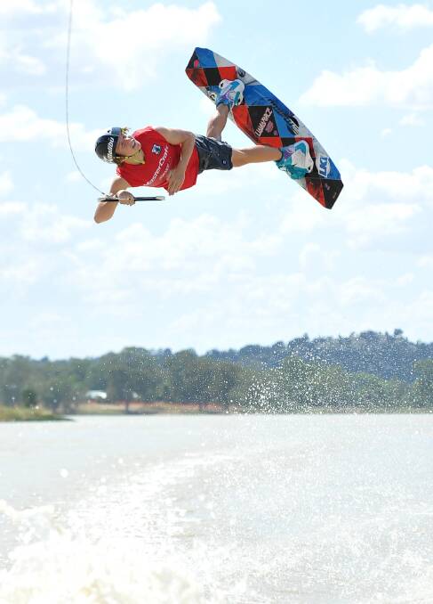 Lewy Watt, 15, gets some air at the national wakeboarding titles at Wagga's Lake Albert. Picture: Michael Frogley