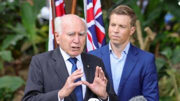 Former PM John Howard with Ryan MP Julian Simmonds during the campaign. Mr Simmonds was defeated by the Greens. Picture: AAP