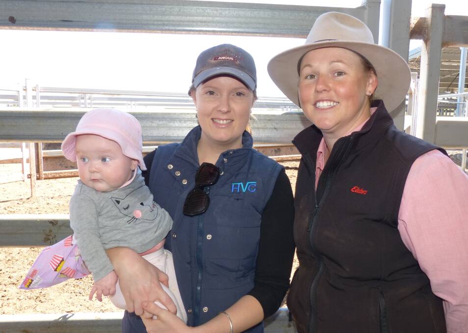 Elders Albury auctioneer, Kirsty Taylor, was chatting with one of her clients, Cassie Sutcliffe, and daughter Eloise, prior to the Wodonga store sale, Thursday.
