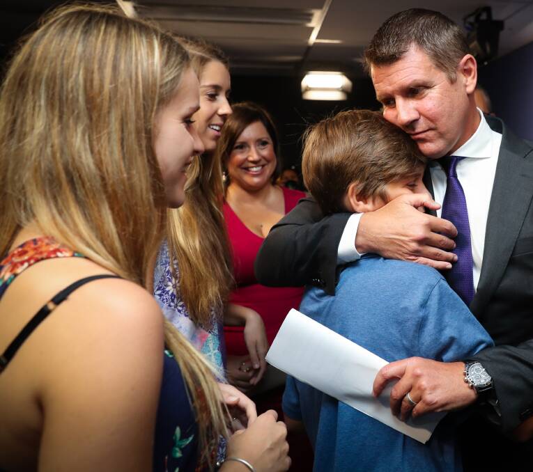 OVER AND OUT: NSW Premier Mike Baird and his family at the media conference announcing his decision to step down.