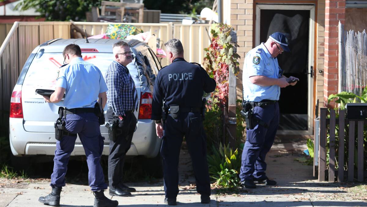 ON SCENE: Officers attended the Mate Street unit on Monday following a reported assault involving an axe that left a man in hospital. Pictures: BLAIR THOMSON