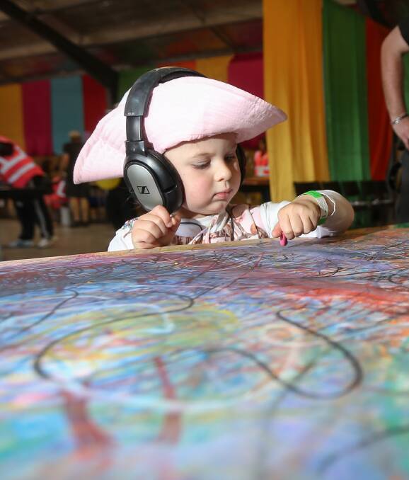 FUN TIMES: Two-year-old Abigail Walls on the drawing sounds table at the event. The table converts images into sound. Pictures: JAMES WILTSHIRE