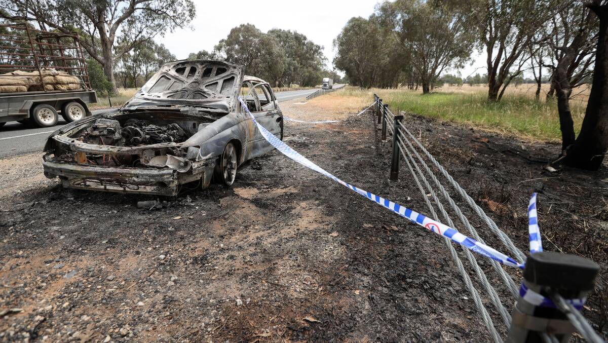 A gutted Holden Commodore on the side of the Hume Freeway at Chiltern on Tuesday. Picture by James Wiltshire