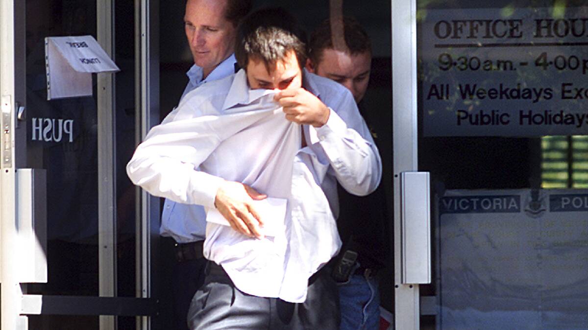 Gruber is led out of Wodonga court in April, 2001, to serve a jail term for heroin supply. File photo