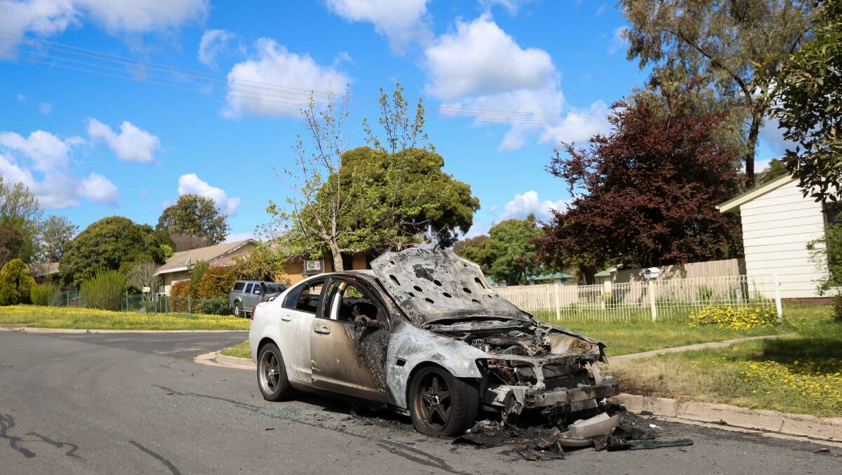 BURNT: This white Holden Commodore, which was destroyed by fire on Resolution Street at the weekend, is one of four vehicles to go up in flames in close proximity in recent weeks. Picture: JAMES WILTSHIRE