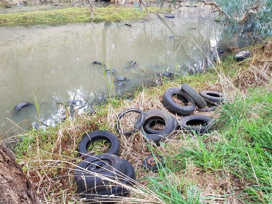 DUMPED: The tyres were offloaded into Whorouly Creek at Whorouly late last month. Information is being sought to identify those responsible on 136 186 or 1800 333 000. 