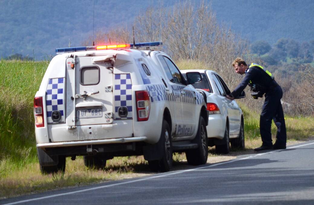 Police check a driver on Yarralumla Drive in Wodonga on Thursday morning as part of Operation Scoreboard, which runs until Sunday. Picture by Blair Thomson