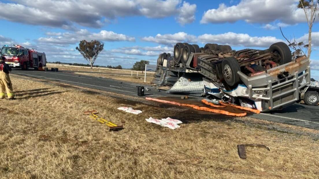 FLIPPED: The truck rolled onto its roof on Federation Way. Picture: FIRE AND RESCUE NSW