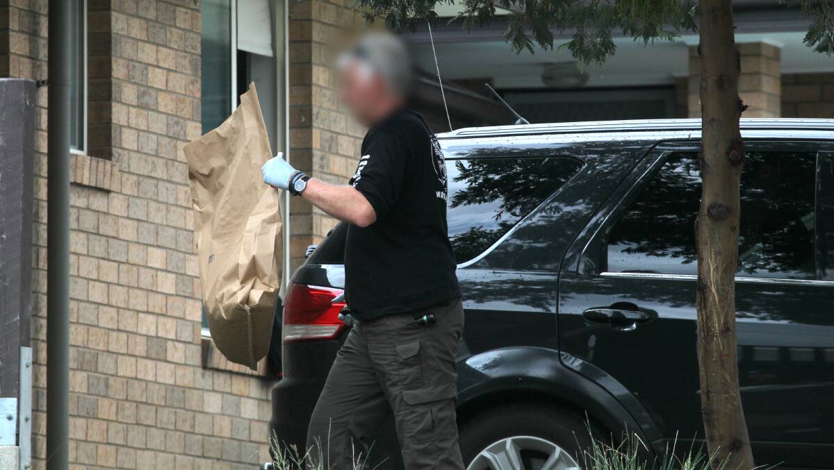 ARREST: Police raid McLean's home in Stott Court last November. 