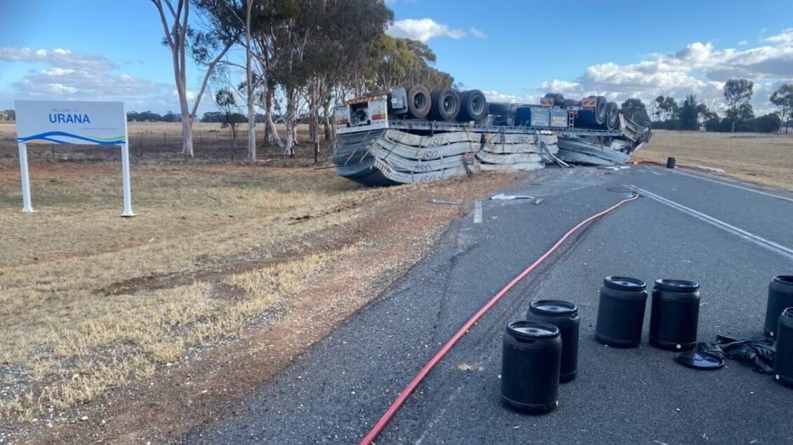 FLIPPED: The truck rolled onto its roof on Federation Way. Picture: FIRE AND RESCUE NSW