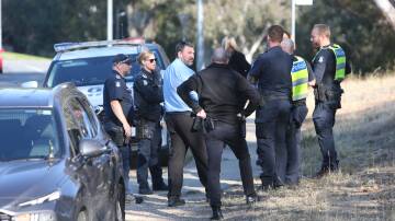 Police search for a knife on Moorefield Park Drive in Wodonga on April 15, hours after an armed robbery at the OTR petrol station. File photo
