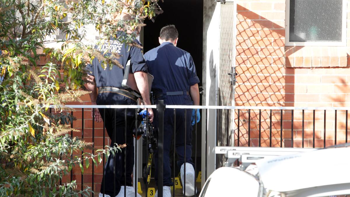 SCENE: Police at the Albury unit following the shooting in May last year. 