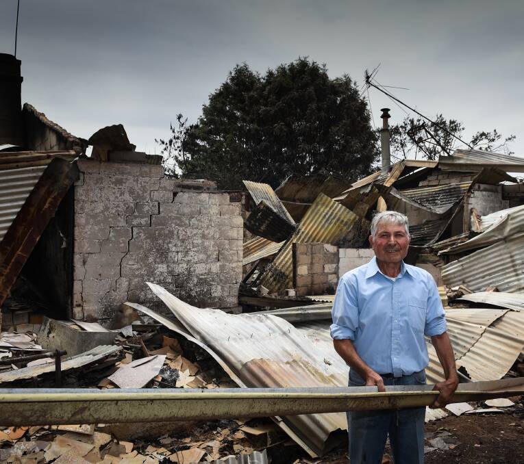 DAMAGE: Frank Bonatesta at his destroyed home in the Indigo Valley. He also lost grapes during the incident.