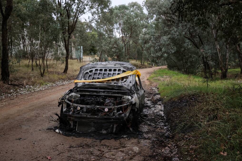 BURNT OUT: The stolen car was torched at Springdale Heights. 