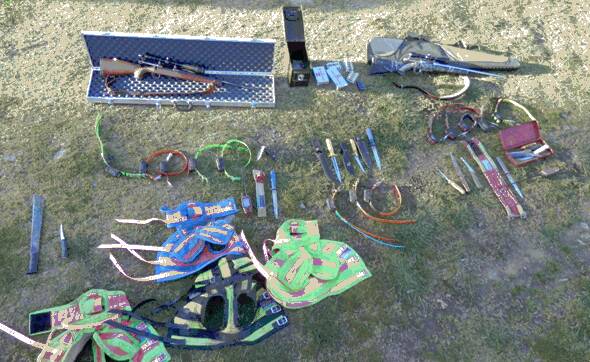 SEIZED: Items including guns, ammunition and knives were taken from the hunters. 