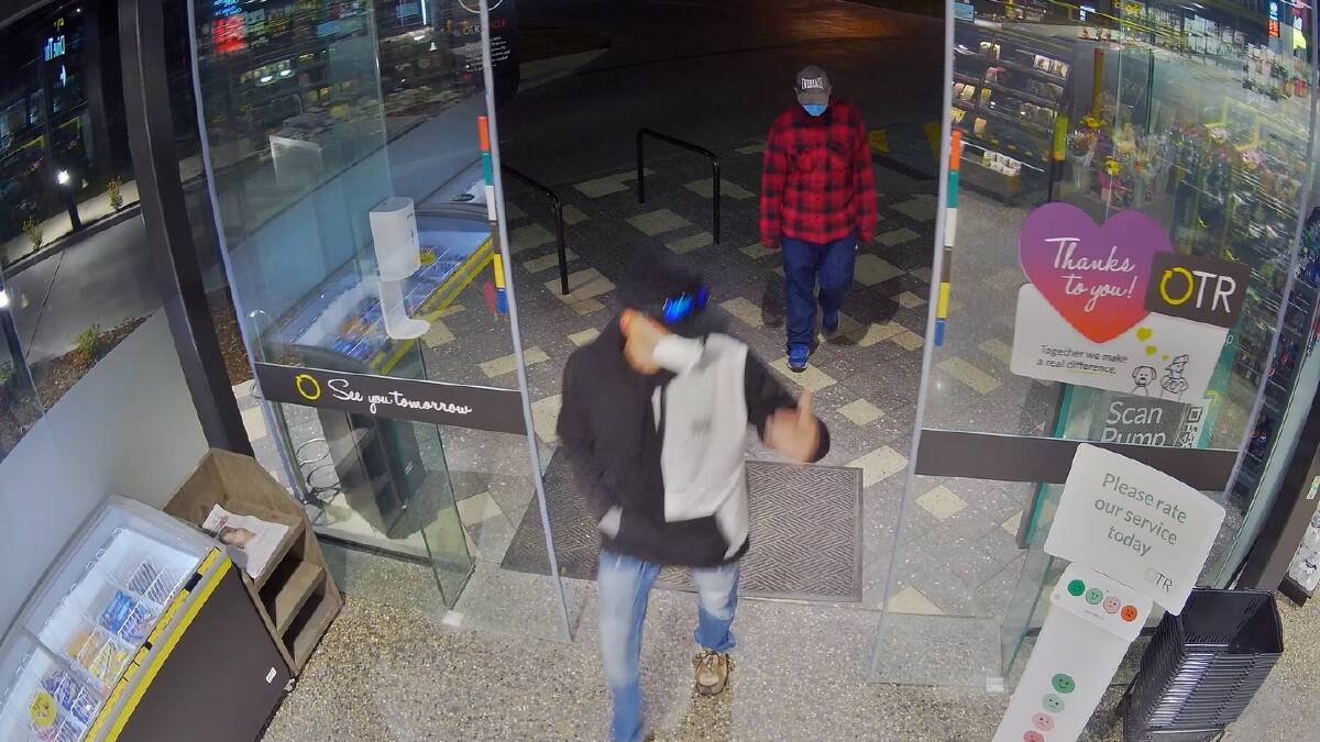 DISTINCT: The pair's clothing was clearly caught on CCTV as they entered. 