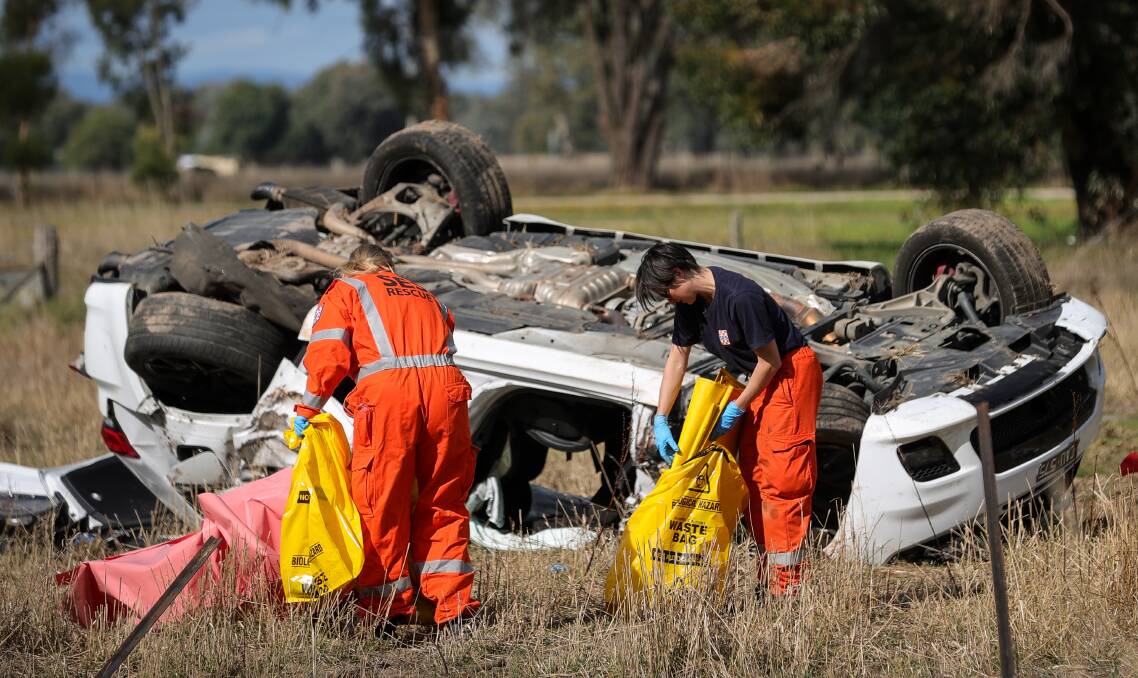 Emergency workers at the scene of the crash on Monday. Picture by James Wiltshire