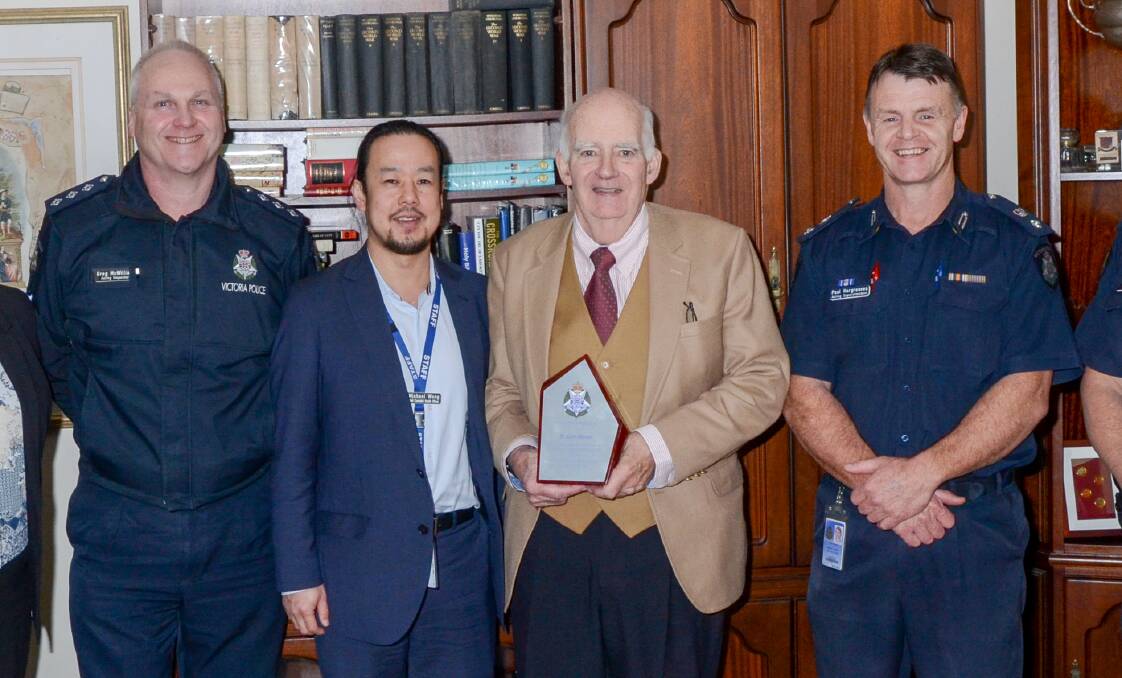 RECOGNITION: Dr John Moran, pictured with a plaque for his service with Acting Inspector Greg McWilliam, Acting Chief custodial health officer Michael Wong and Acting Superintendent Paul Hargreaves. 