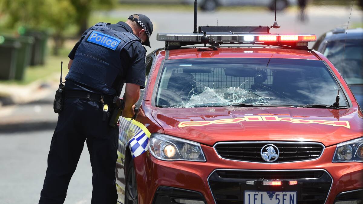 CRACKED: The smashed police windscreen, which was damaged while officers tried to arrest Clarke. 