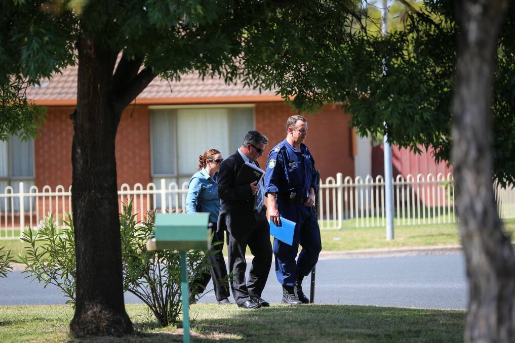 INVESTIGATING: Police outside a Webb Street property in November 2016, following the death of Lloyd Kennedy. Adam Azzi has pleaded not guilty to his murder. 