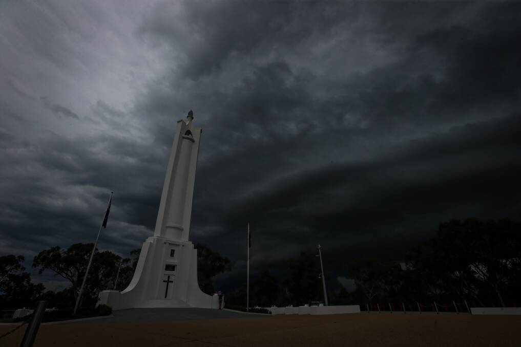 STORM BREWING: Dark clouds formed to the north east of Albury on Saturday night before dumping rain on the city, with more forecast this week. Picture: JAMES WILTSHIRE
