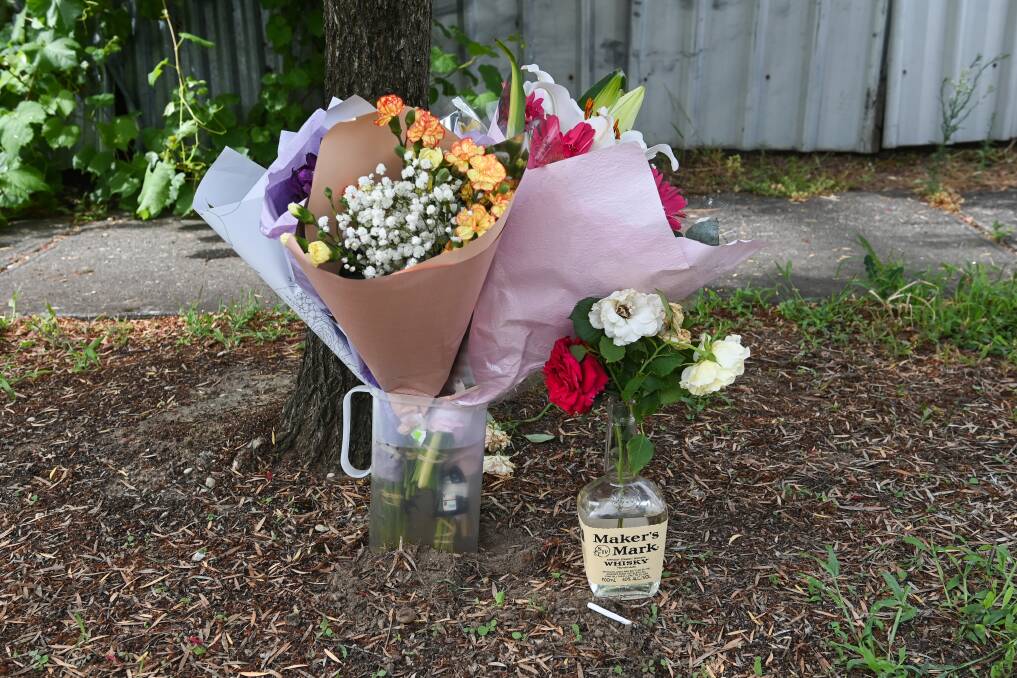 MOURNING: Tributes left to Duwayne Johnson, pictured right, following an alleged shooting in Wodonga last weekend. 
