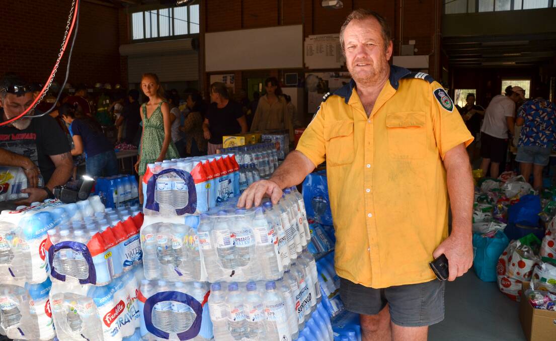 HELPING HAND: The Lavington Rural Fire Brigade has been a hive of activity as people make donations. Bruce Barnes has been amazed by the support. Picture: BLAIR THOMSON