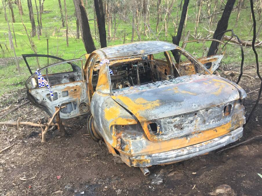 BURNT OUT: A Holden VT Commodore dumped of the side of a hill on Centaur Road. 