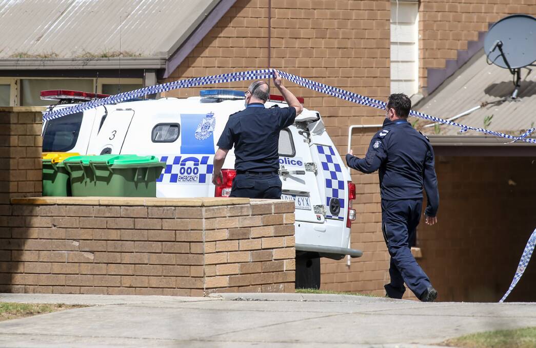 CRIME SCENE: Officers at a Quirk Court home on Wednesday as they investigate a reported drive-by shooting. 