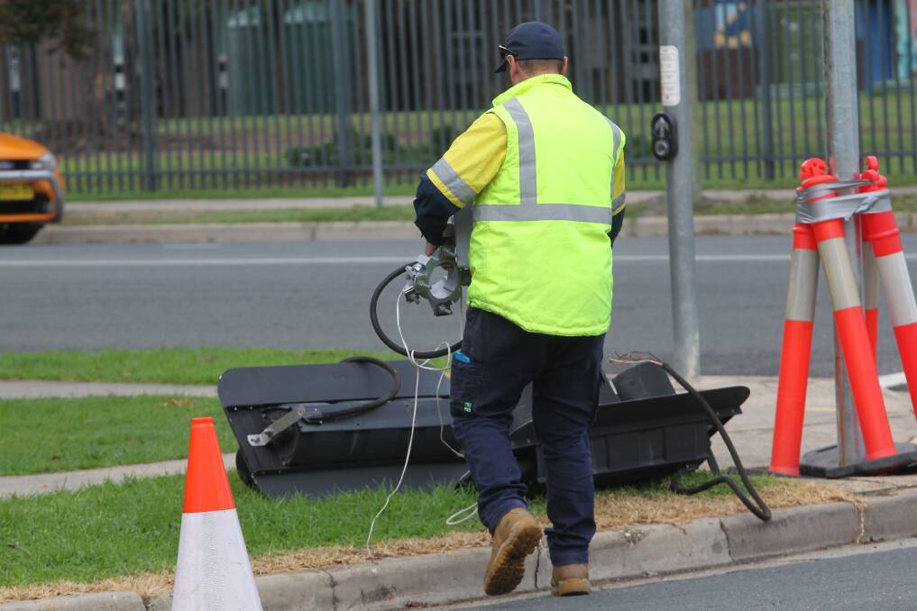 CRASH: A contractor works to repair the damage on Friday morning after a crash the night before. Picture: BLAIR THOMSON