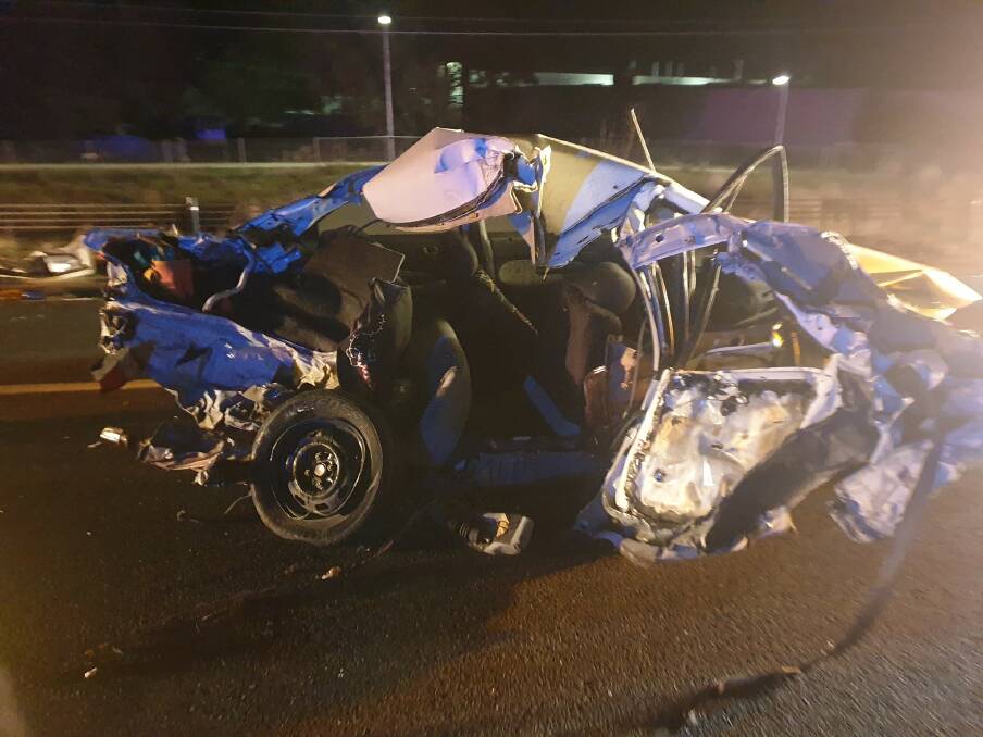 IMPACT: There was extensive damage to one of the cars after being hit by a truck on the Hume Highway on Monday morning. Paul Marshall said it was lucky no-one was inside. Picture: ALBURY AND BORDER RESCUE SQUAD