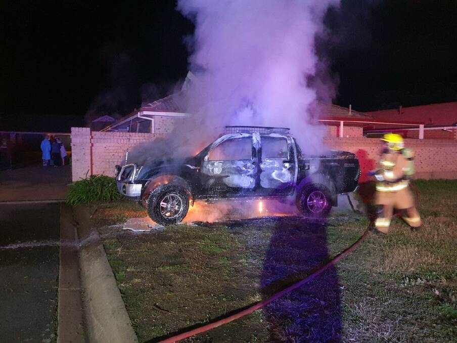 ON SCENE: Firefighters spent about half-an-hour at the scene of the blaze on Thursday morning. The Isuzu utility was gutted by the flames. 