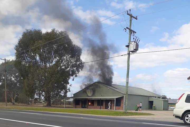 ALIGHT: Smoke pours from the shed. Picture: FACEBOOK