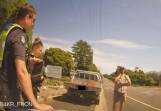 Police dashcam footage captured Timothy Prime speaking to his partner after he was caught speeding to their home. She had found a snake in her jeans. Picture supplied 