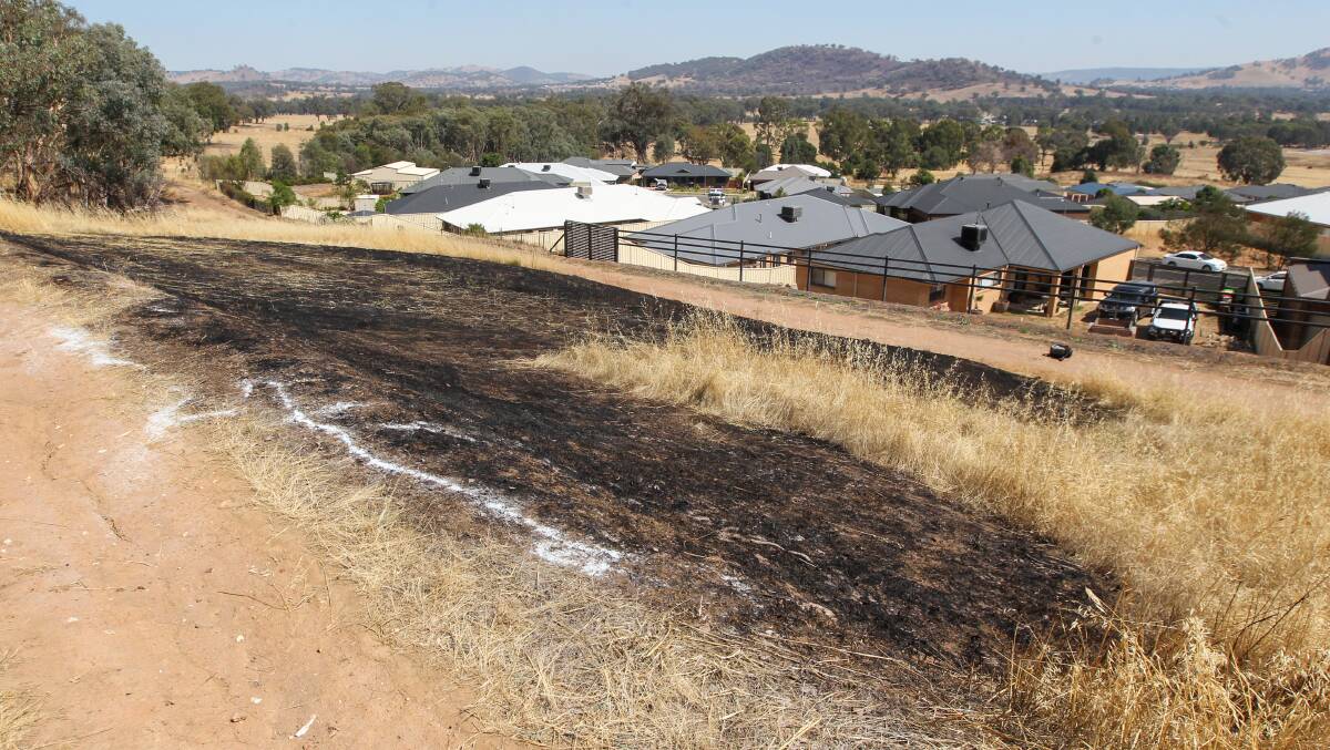CLOSE: The fire burnt grassland near homes. Picture: BLAIR THOMSON
