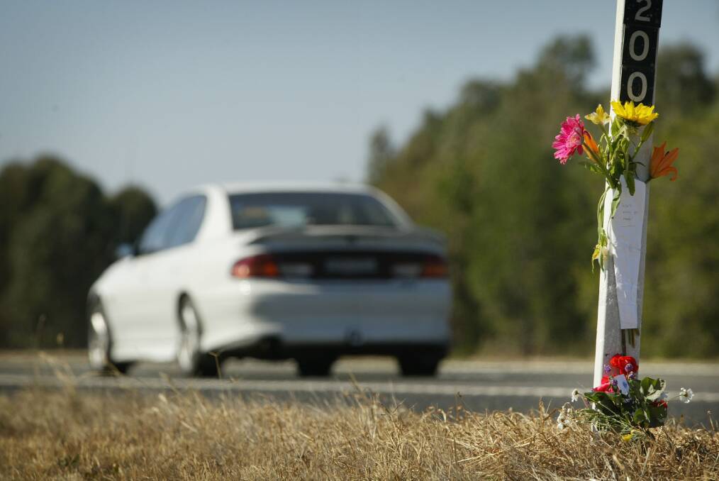 TRAGIC SCENE: Flowers left at the scene of a Benalla policeman's death in April, 2005. 