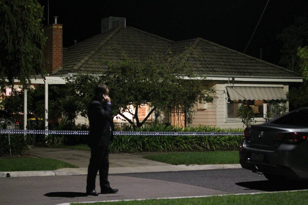 ON SCENE: A homicide detective outside the Wangaratta home following the shooting. 