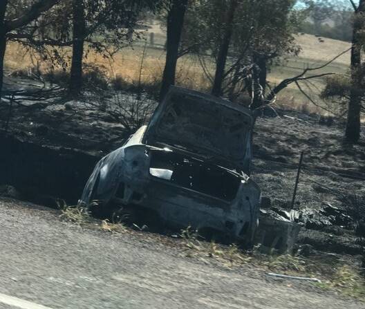 AFTERMATH: The gutted Audi on the side of the Hume Highway