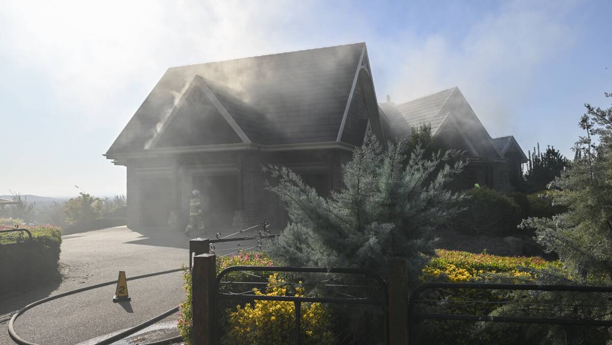 Smoke at the burning property on Friday morning. Picture by Mark Jesser